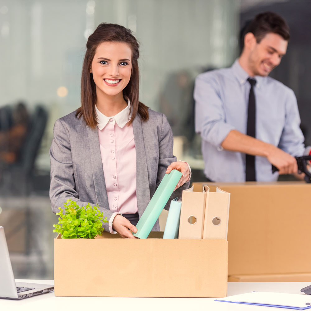 office employees packing boxes